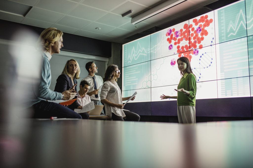 Meeting in Front of a Large Display Screen