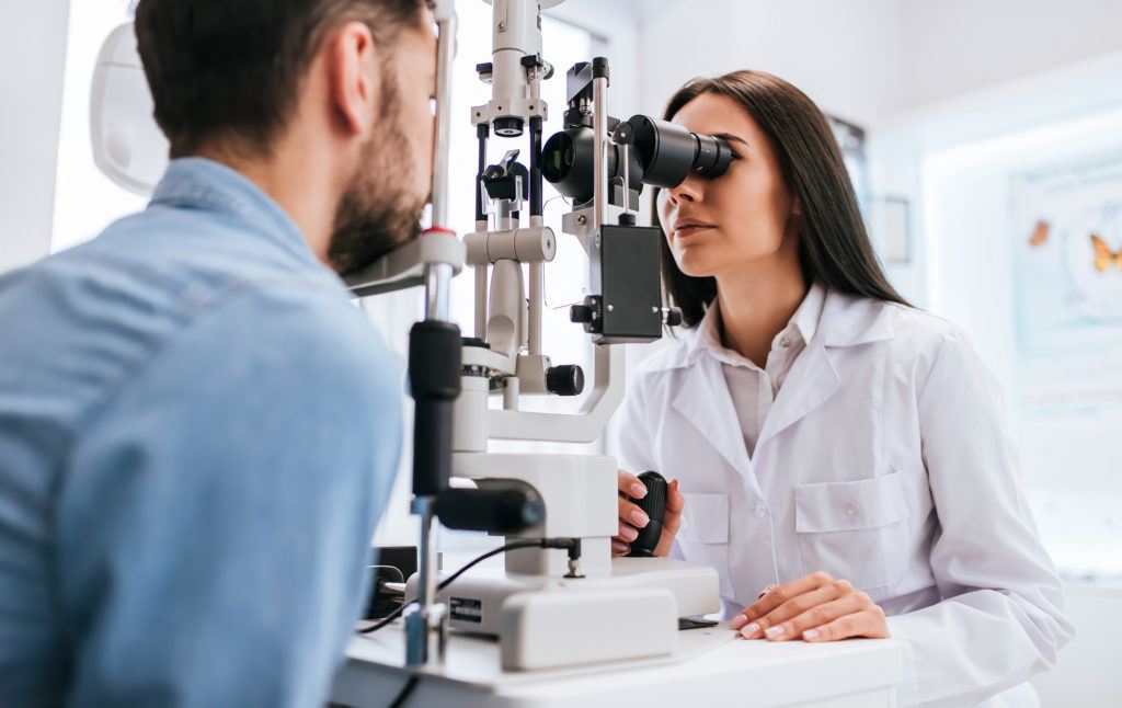 Doctor and patient in ophthalmology clinic