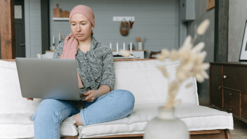 healthcare influencer marketing cancer patient watching laptop on couch