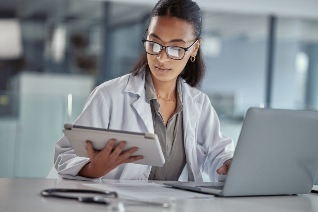 AI-generated healthcare content, doctor using tablet and laptop